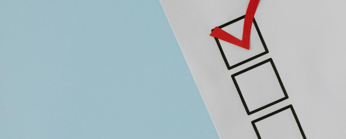 red check mark over black box